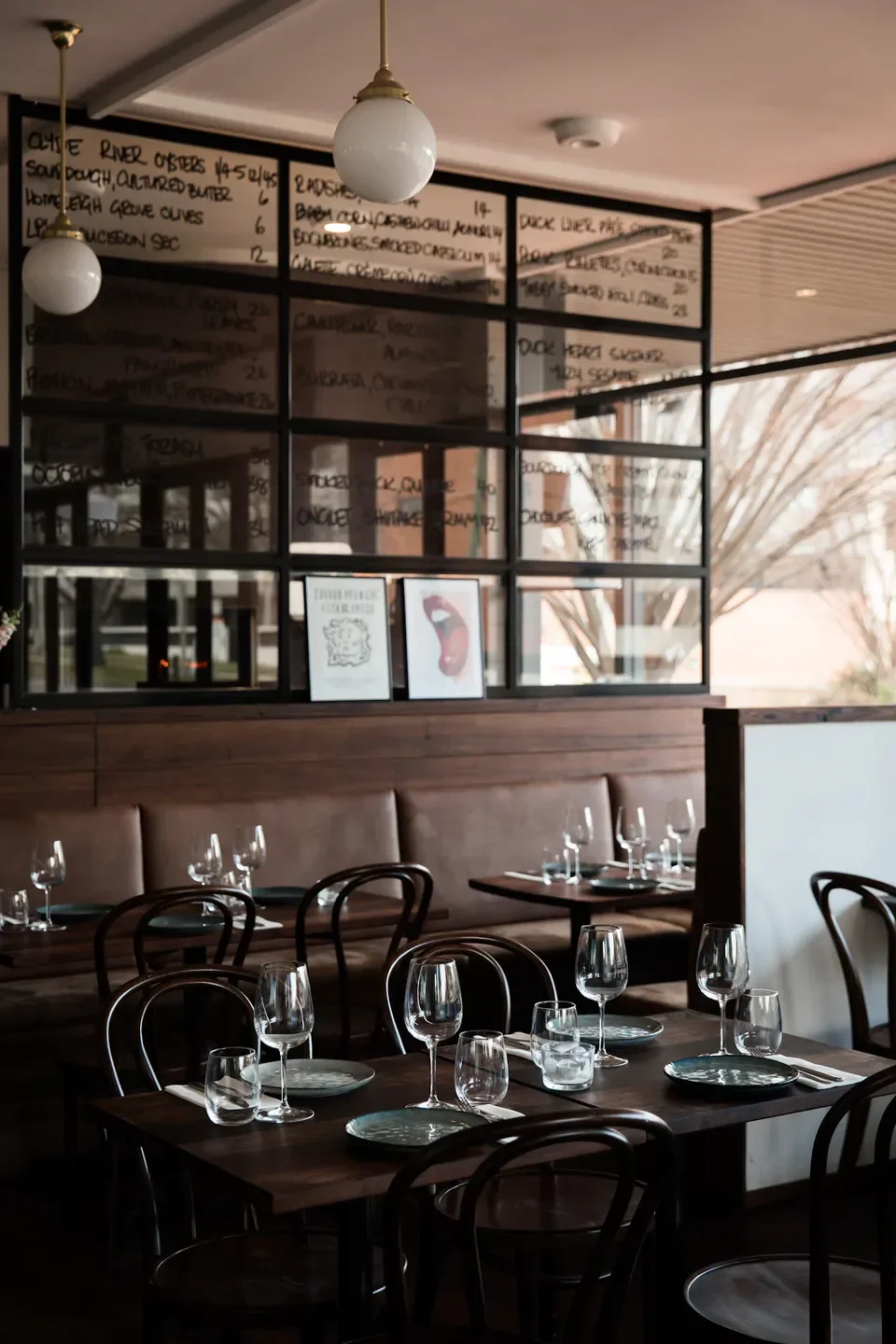 Interior of 11e CAVE restaurant in Canberra, showcasing elegant dining tables and ambiance.