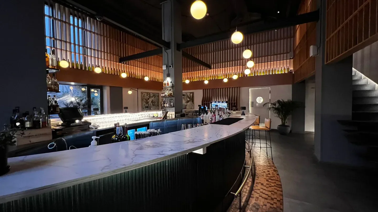 Interior of 13C Bar in the back, Amman. Stylish bar with marble countertop and modern design.