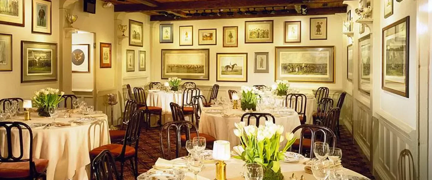 Elegant dining room at 1789 Restaurant & Bar in Washington, DC, with art.