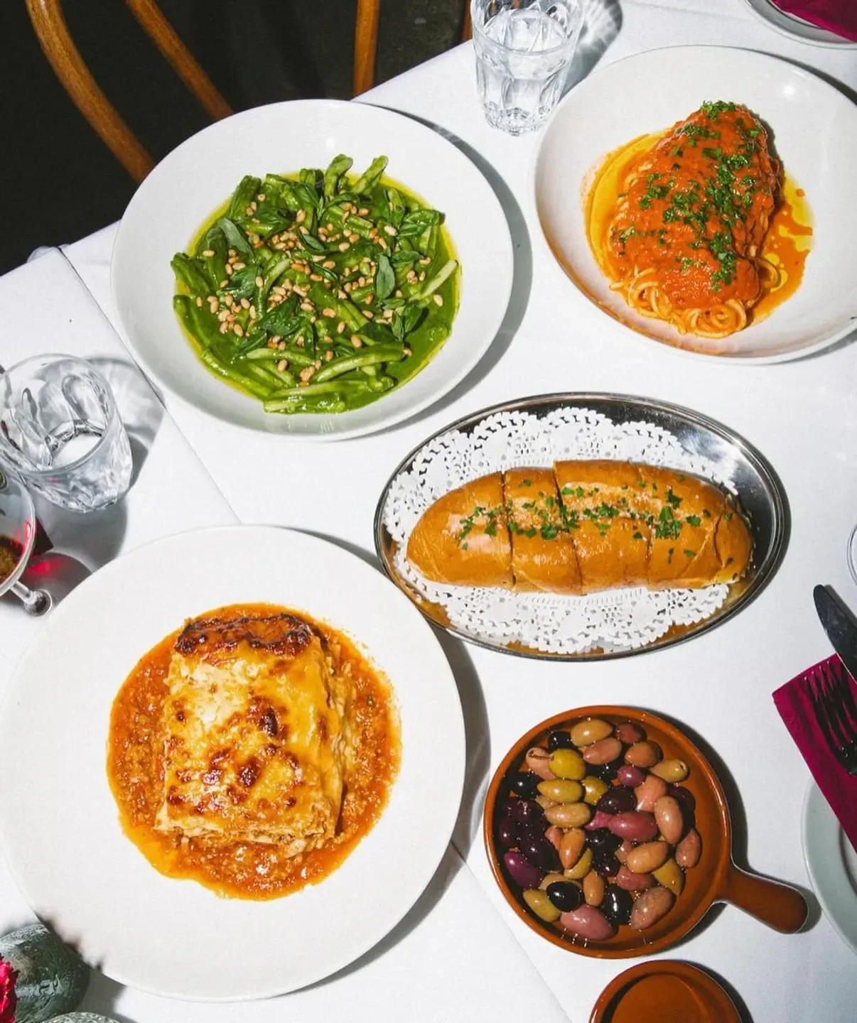 Delicious dishes from 1800 Lasagne in Melbourne, including pasta, lasagna, and olives.