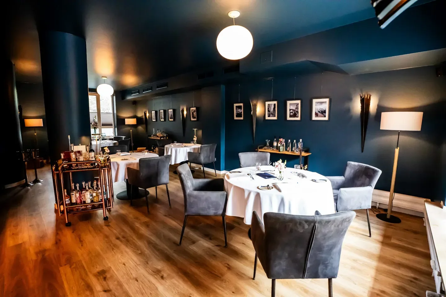 Elegant dining room at 1876 Daniel Dal-Ben restaurant in Düsseldorf with tables set
