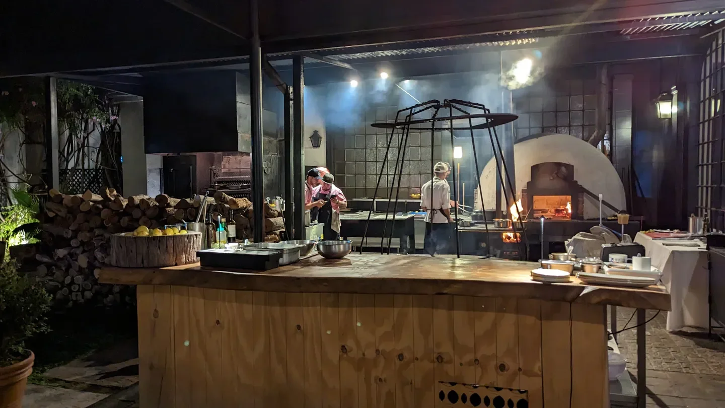 Chefs preparing food in the open kitchen of 1884 Restaurante, Mendoza, Argentina