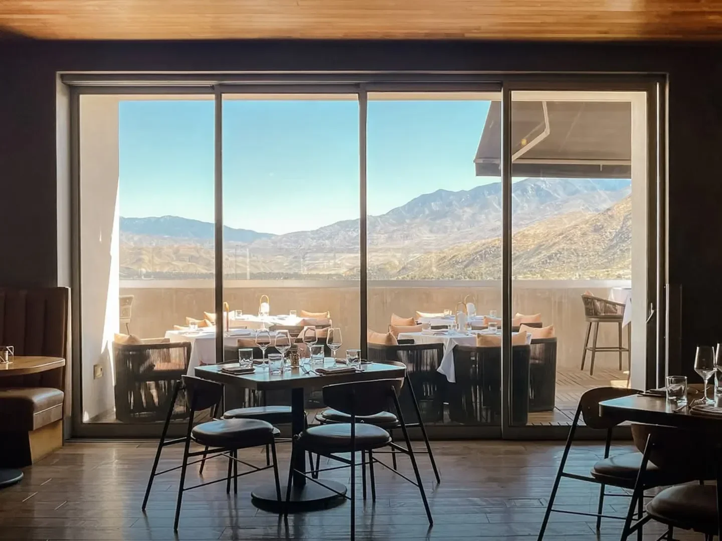 Dining room view at 4 Saints restaurant in Palm Springs with mountain backdrop.