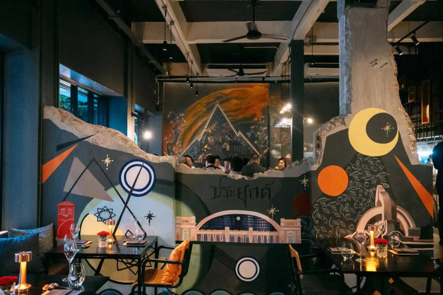 Stylish interior of 80/20 Eighty Twenty restaurant in Bangkok featuring artistic wall decor and elegant table settings