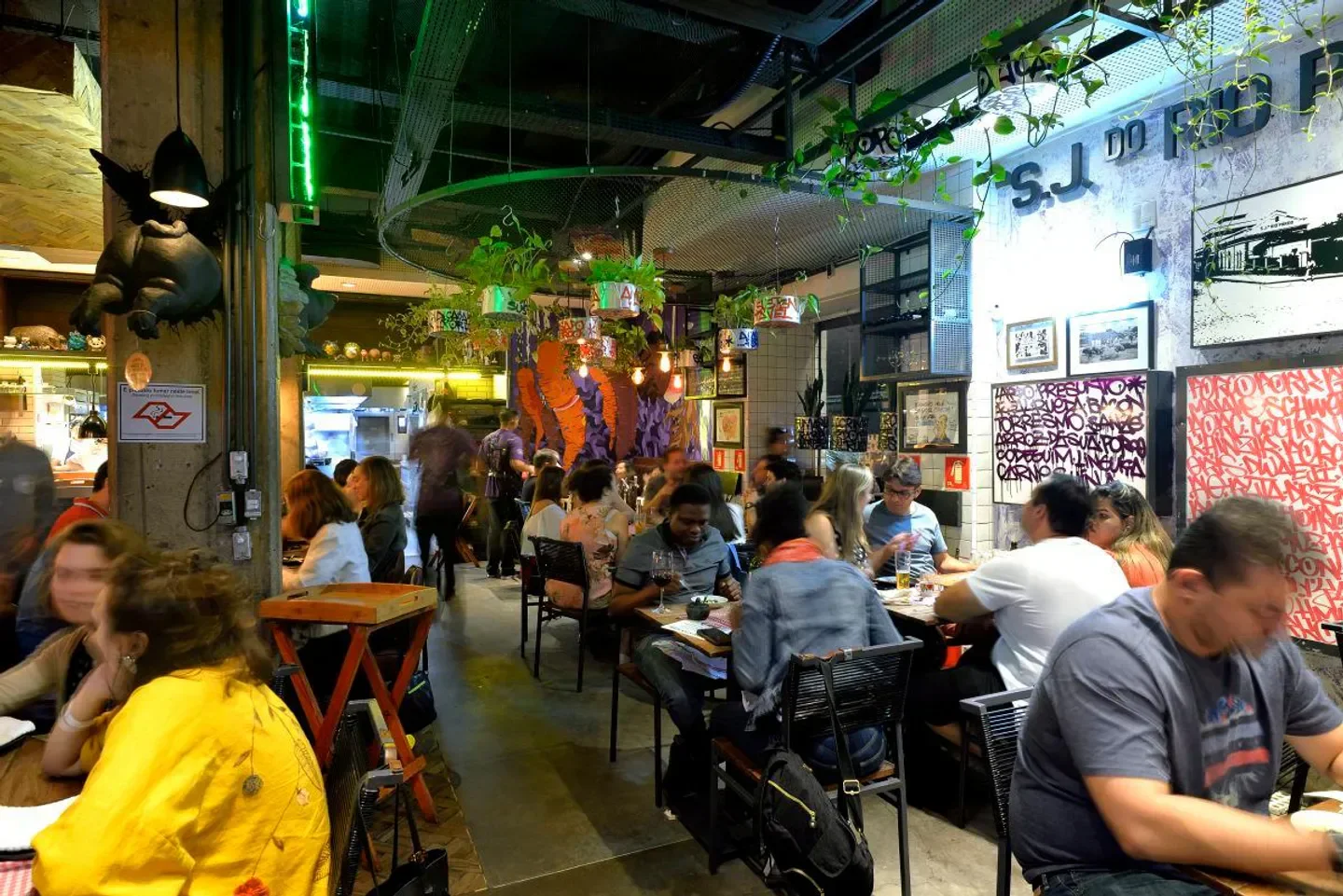 Busy dining room at A Casa do Porco restaurant in Sao Paulo, with lively atmosphere