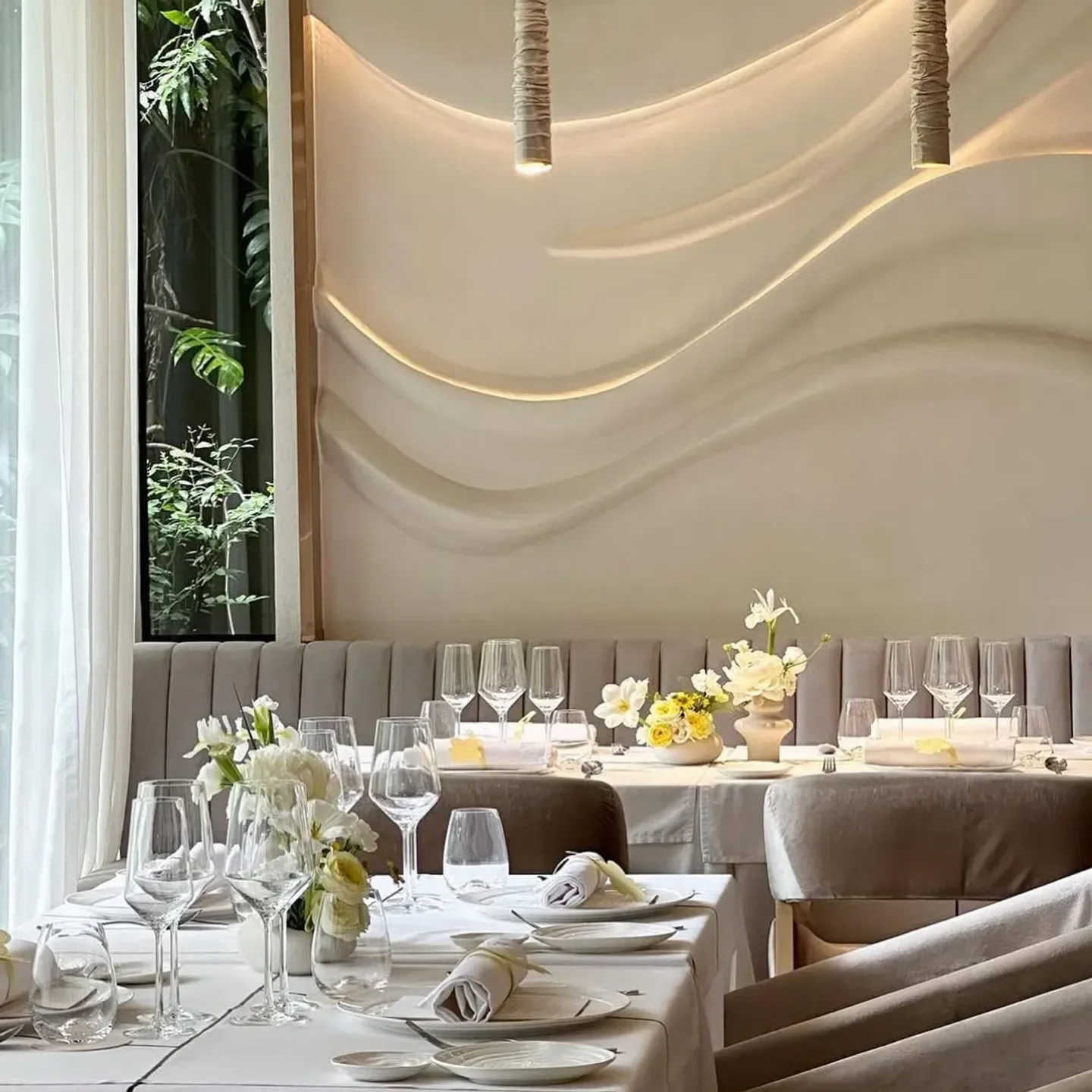 Elegant dining at Acqua Restaurant Bangkok with floral decor and refined atmosphere