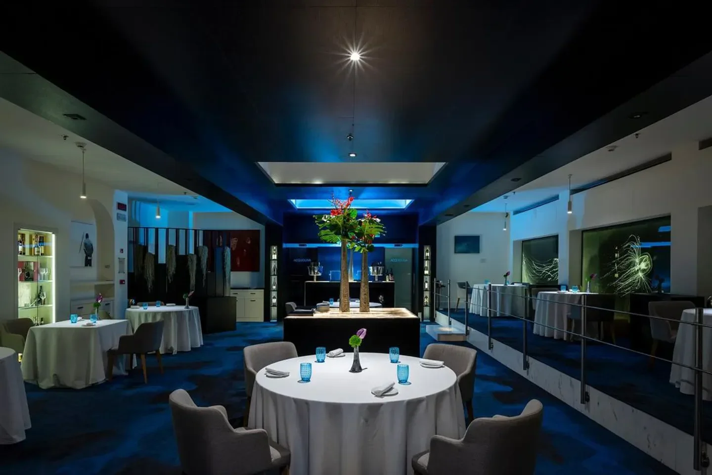 Elegant interior of Acquolina restaurant in Rome, featuring a modern dining room setting.