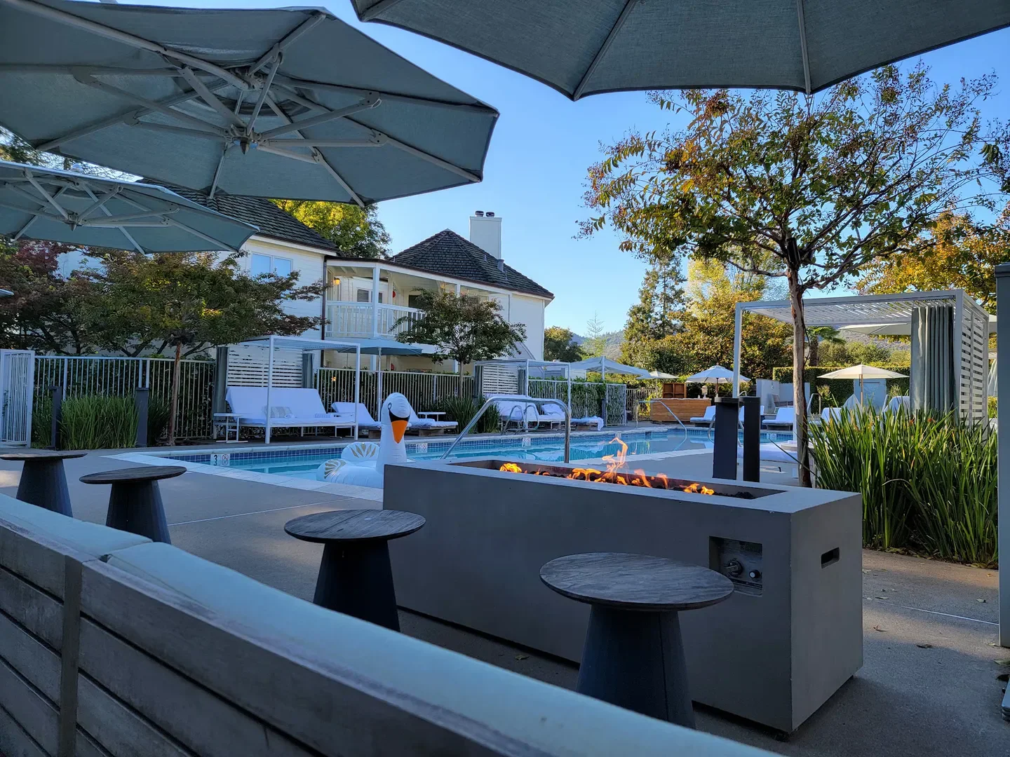 Ad Hoc restaurant in Napa Valley with pool, fire pit, and outdoor seating area.