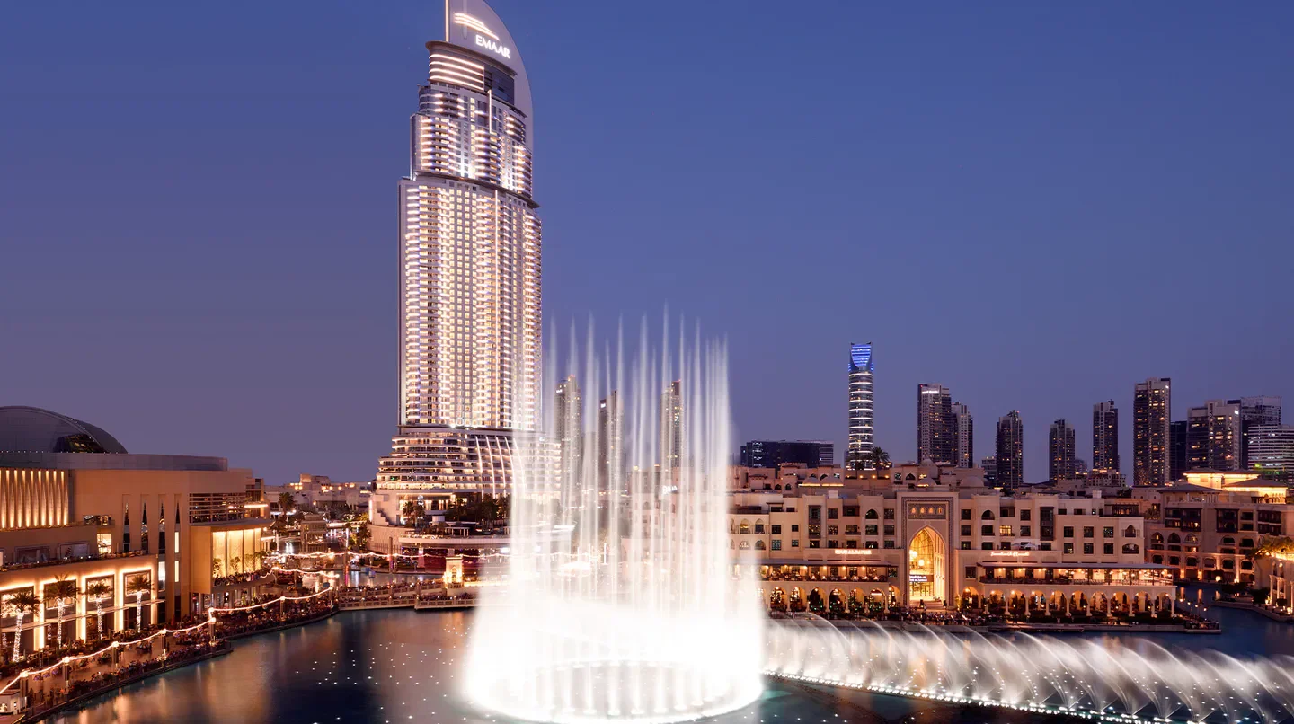 Address Downtown Dubai at dusk with fountain display and city skyline views.