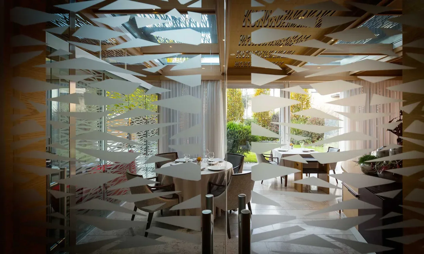 Interior of Agli Amici restaurant in Friuli-Venezia Giulia, featuring stylish decor and dining