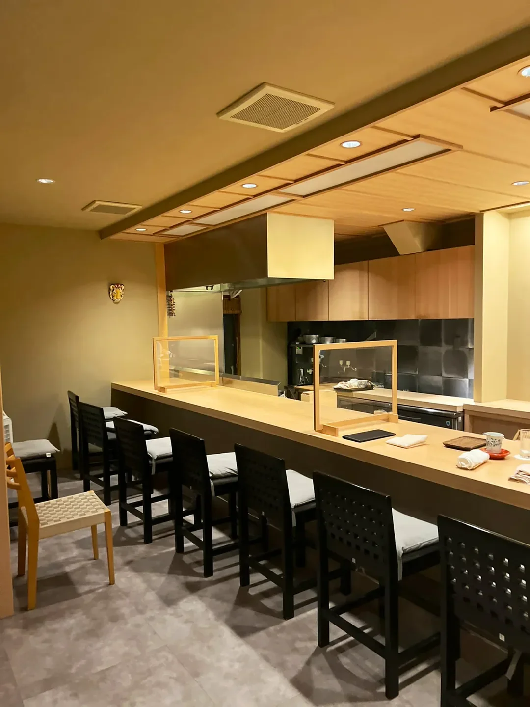 Elegant dining counter at Ajinokaze Nishimura in Nara, Japan, ready for service.