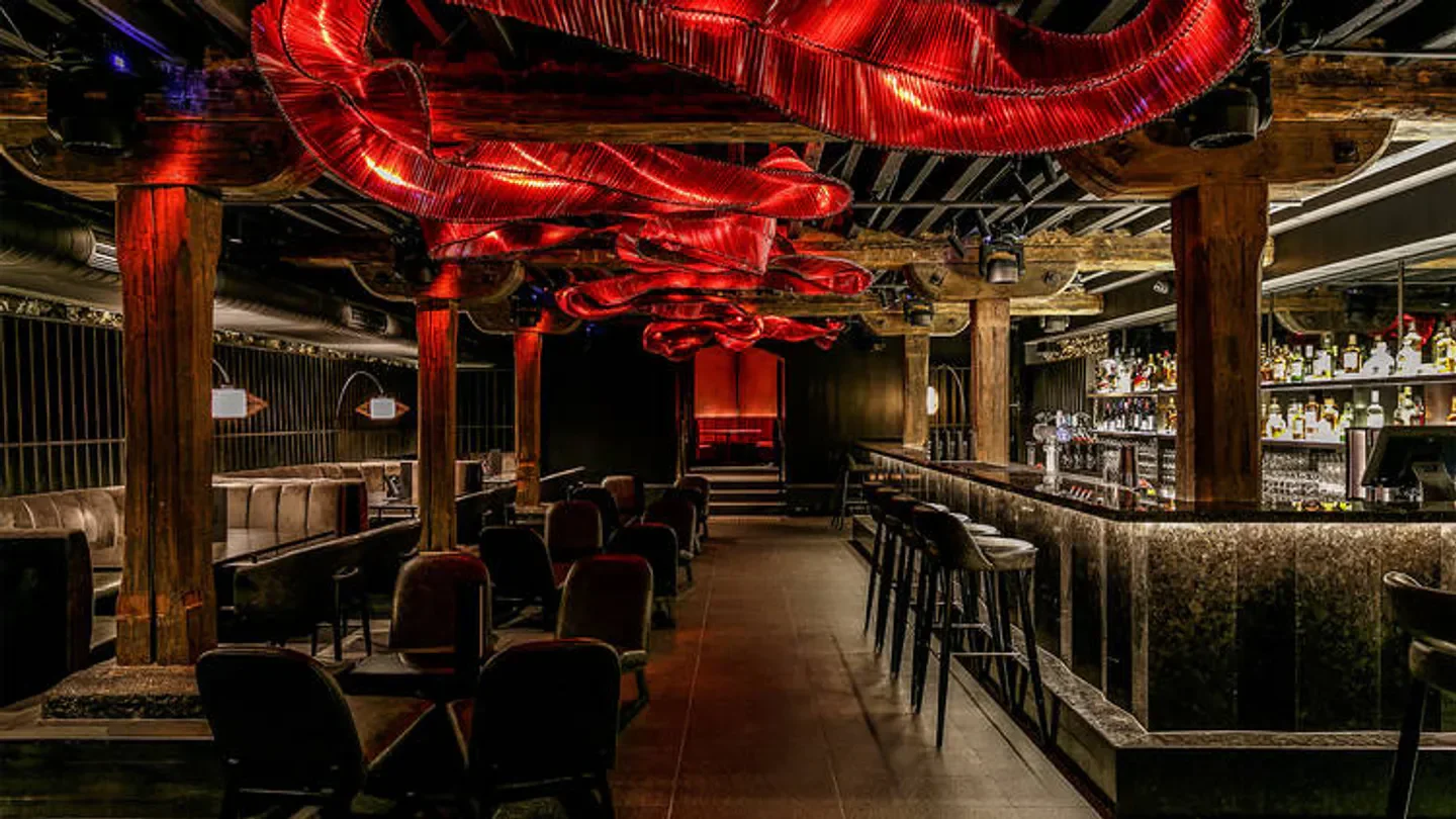 Interior of Akaiito Melbourne restaurant, with red accents and a stylish bar area.