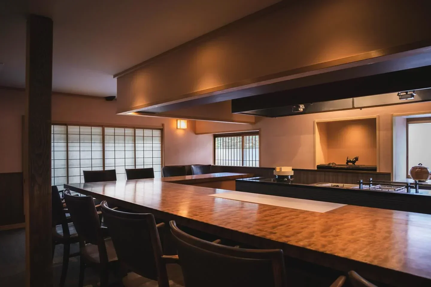Interior of Akasaka Kikunoi restaurant in Tokyo, featuring a long counter and seating.