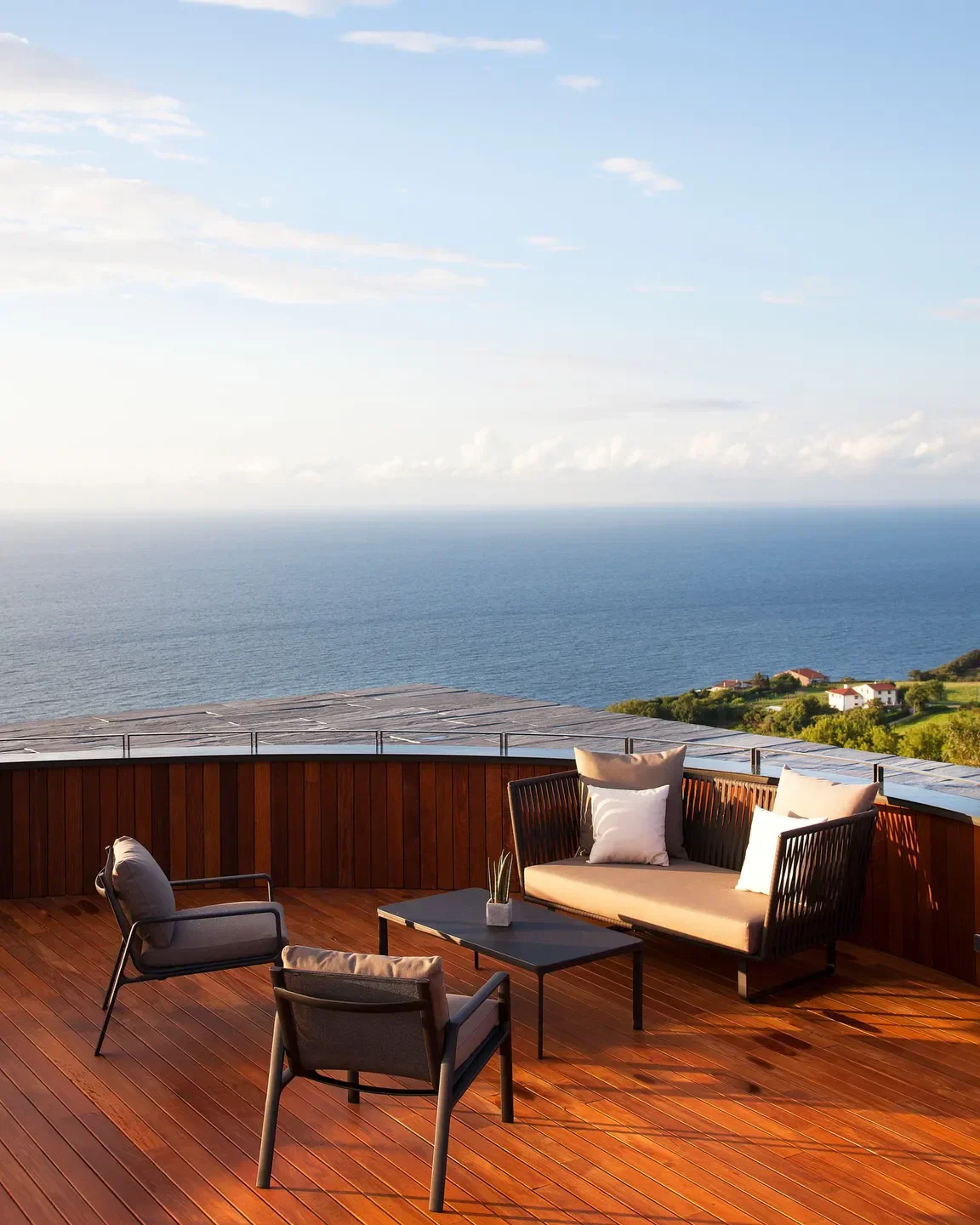 Outdoor seating at Akelaŕe restaurant in San Sebastian with ocean views