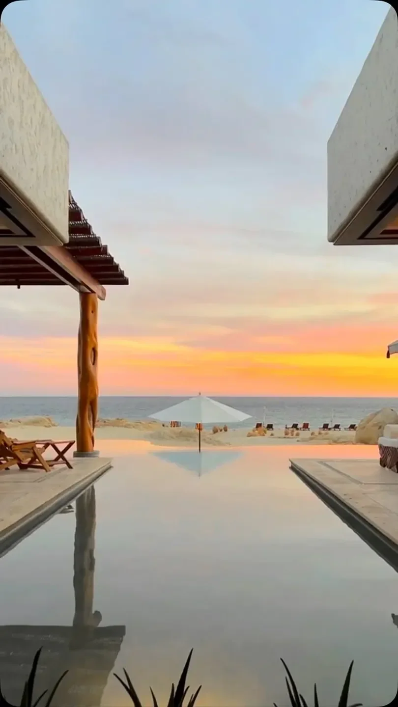 Alebrije restaurant in San José del Cabo, with a sunset view over the pool and ocean.