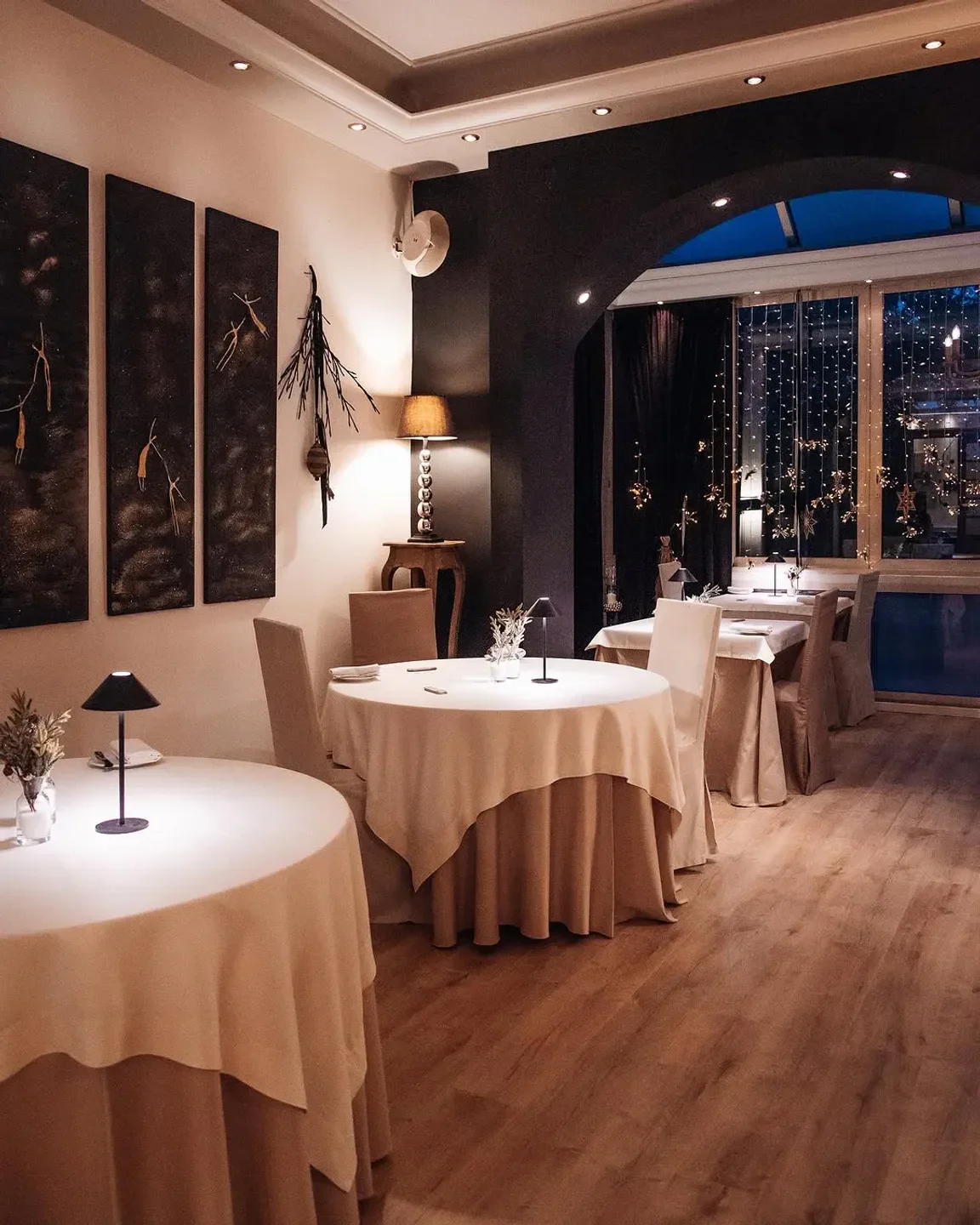 Cozy dining room at Aleria Restaurant in Athens, with elegant table settings.