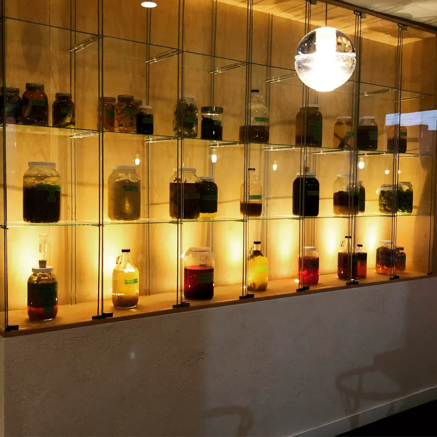 Alice restaurant in Ottawa showcasing glass jars with ingredients on display.