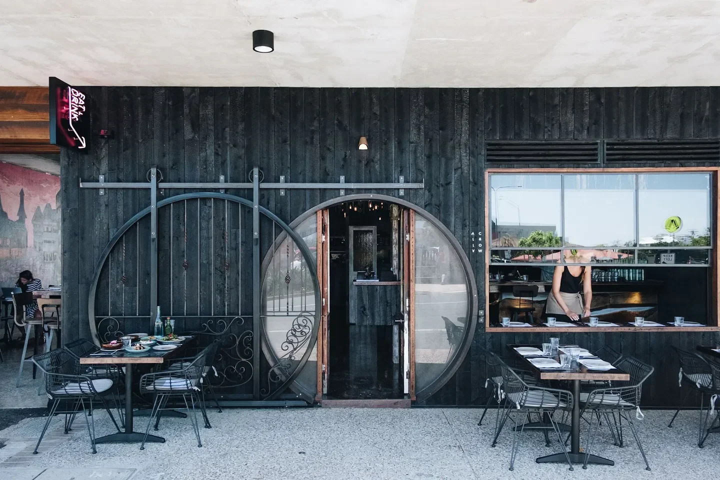 Exterior view of Ally Chow restaurant in Gold Coast with outdoor seating and unique entrance