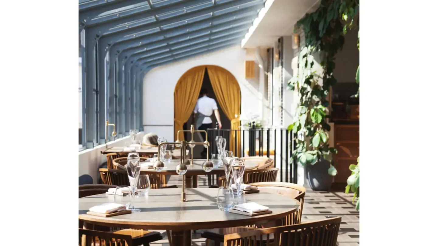 Elegant dining room at Alouette restaurant in Copenhagen, with a touch of nature.