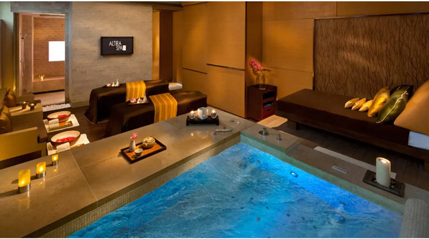 Altira Spa in Macau, featuring a tranquil spa setting with a jacuzzi and massage beds.