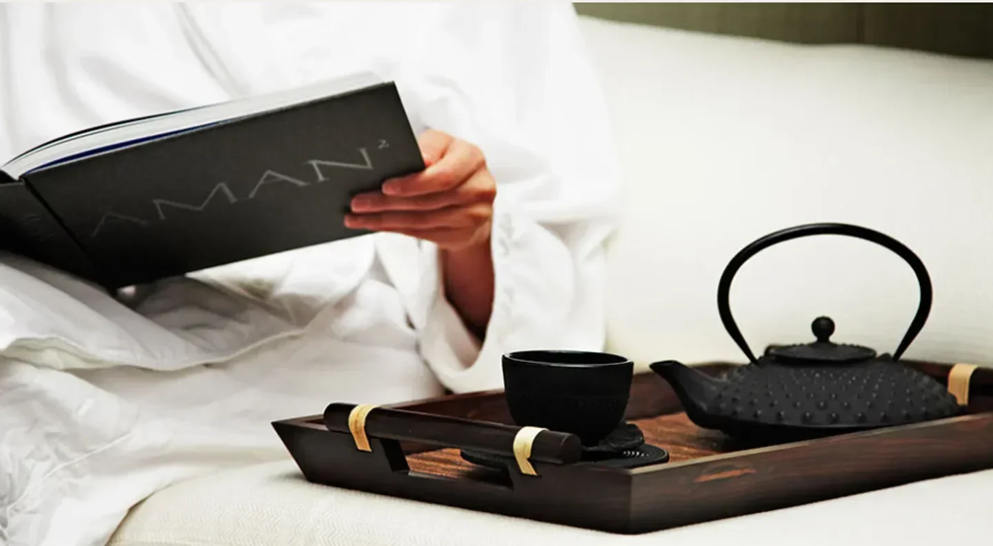 Relaxing spa experience at Aman Spa at The Connaught in London with tea and book.