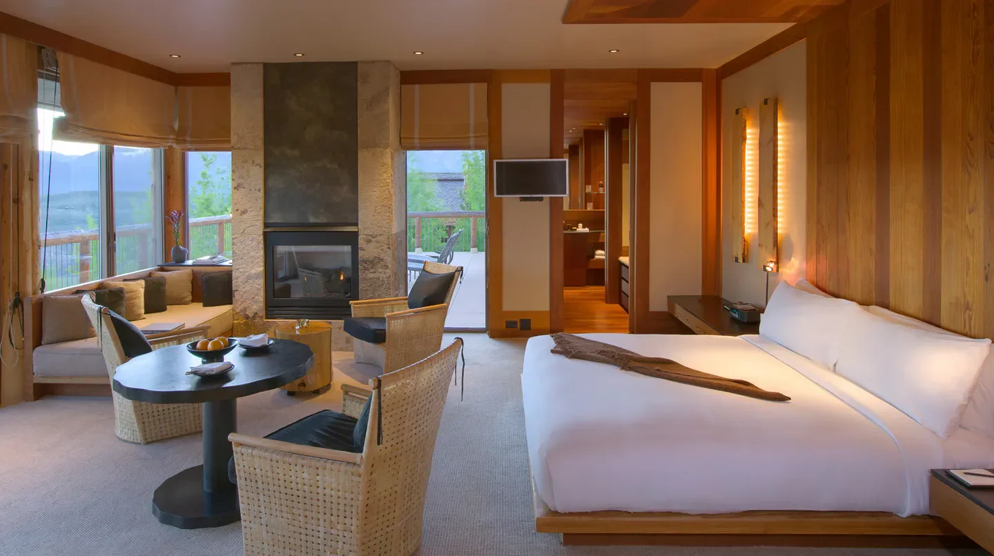 Cozy hotel room at Amangani in Salt Lake City with fireplace and mountain views