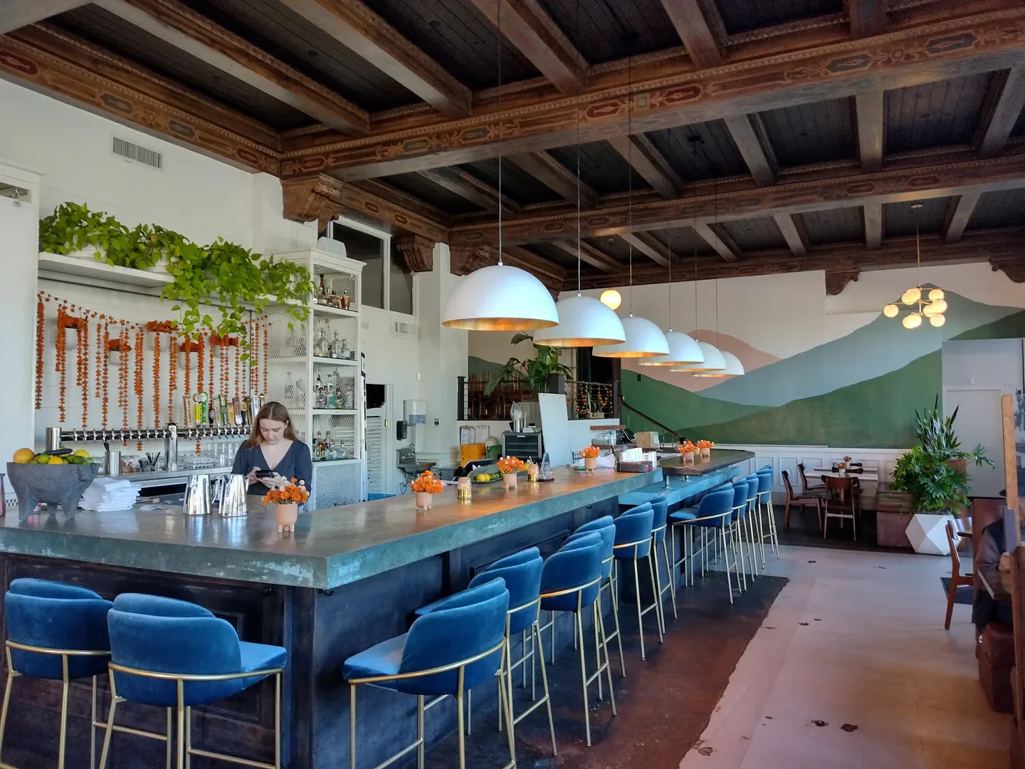 Interior view of Amano restaurant in Boise, featuring bar and seating area.