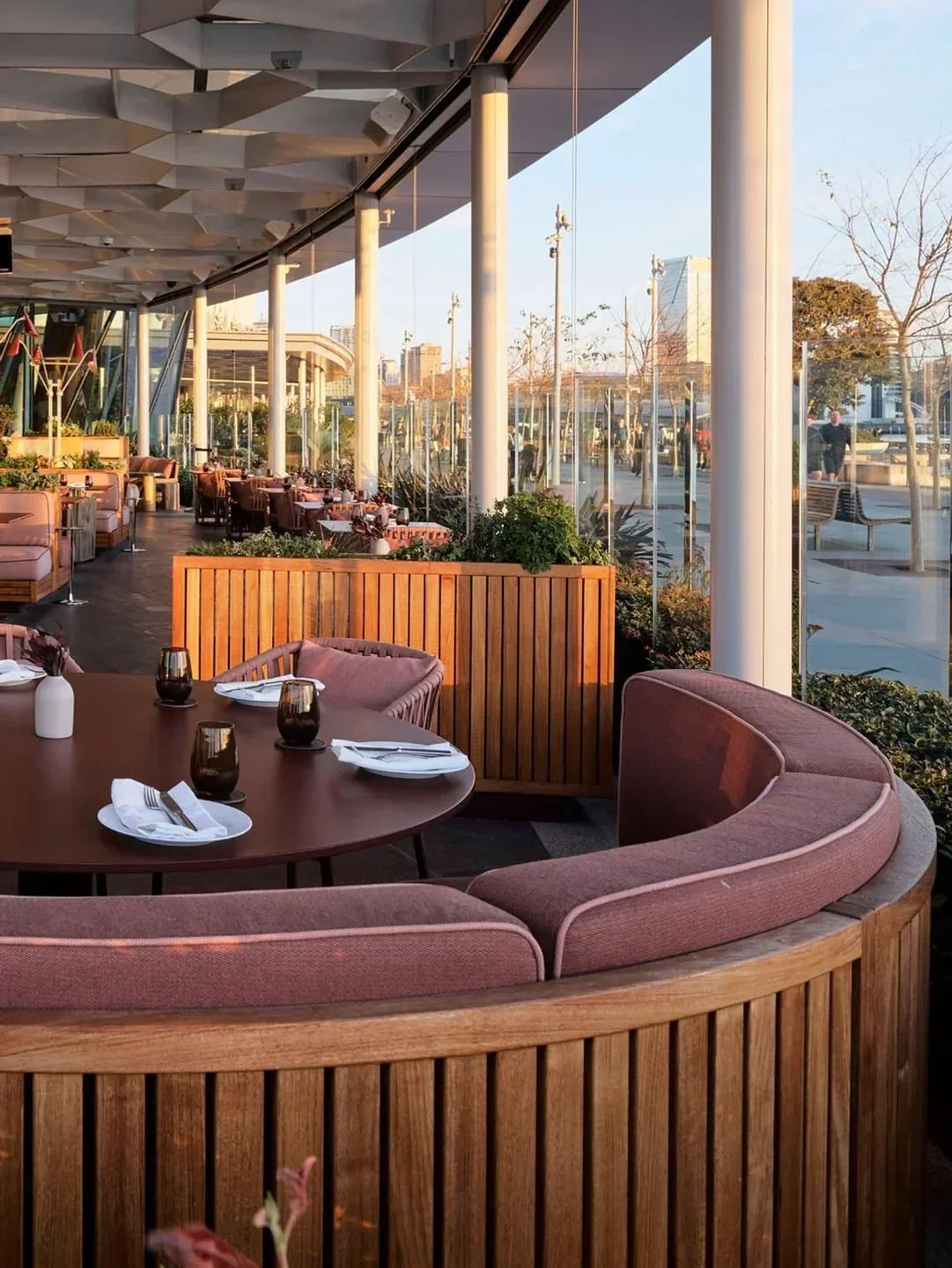 Outdoor seating at a’Mare restaurant in Sydney, featuring modern design and city views
