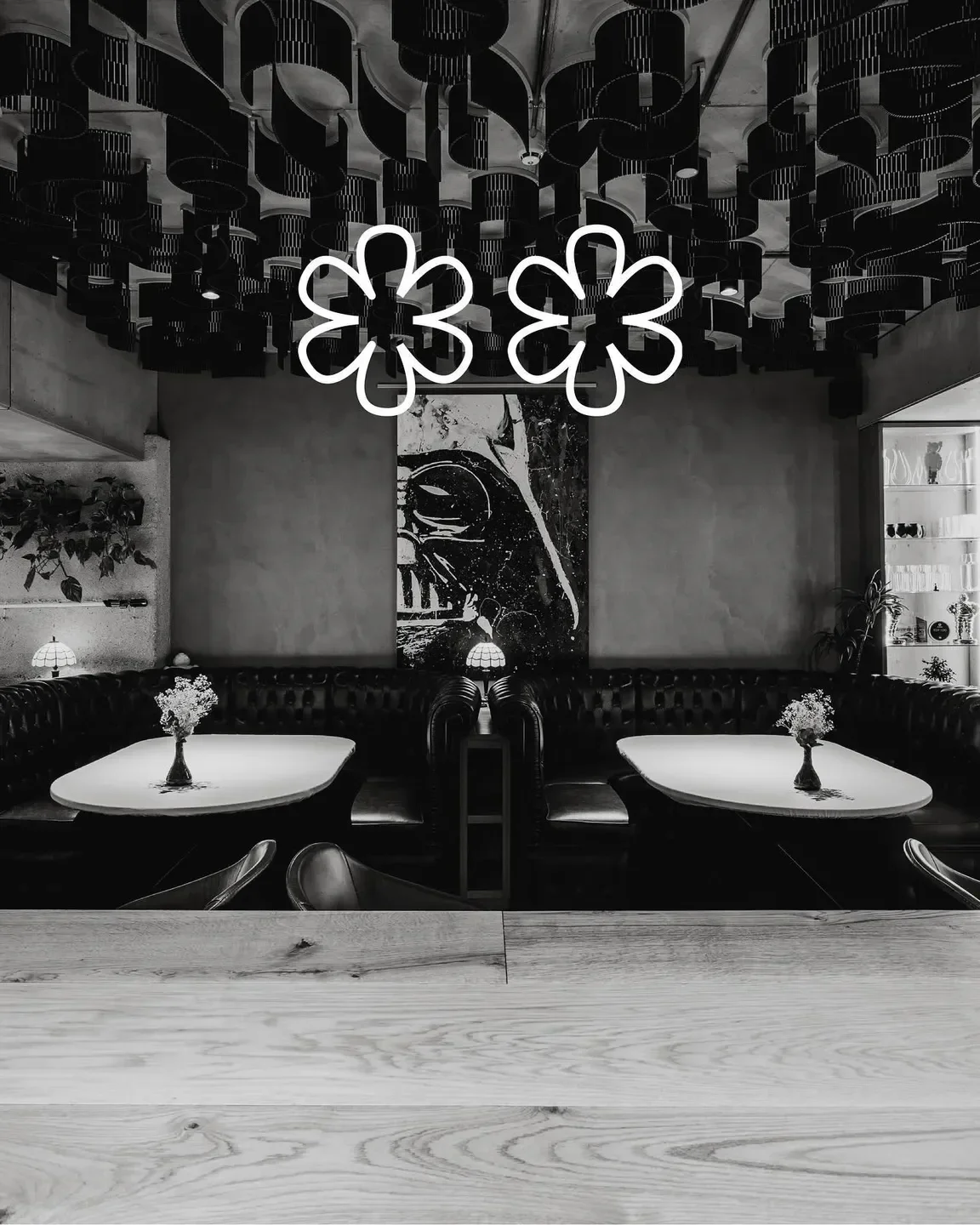 Interior of Amelia by Paulo Airaudo in San Sebastian, featuring stylish flower lights and decor.