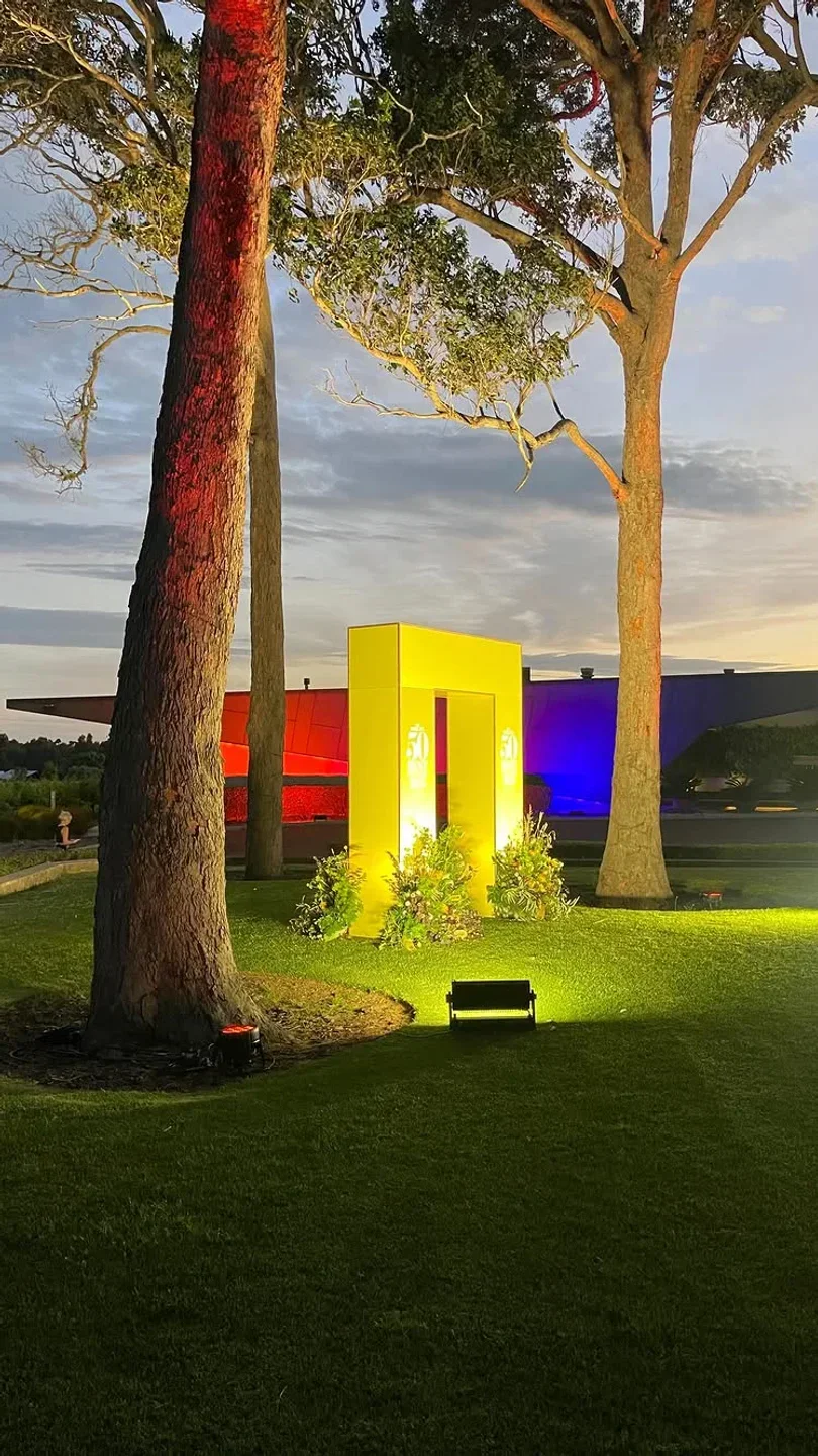 Outdoor view of Amelia Park Restaurant in Margaret River, with trees and modern architecture at dusk