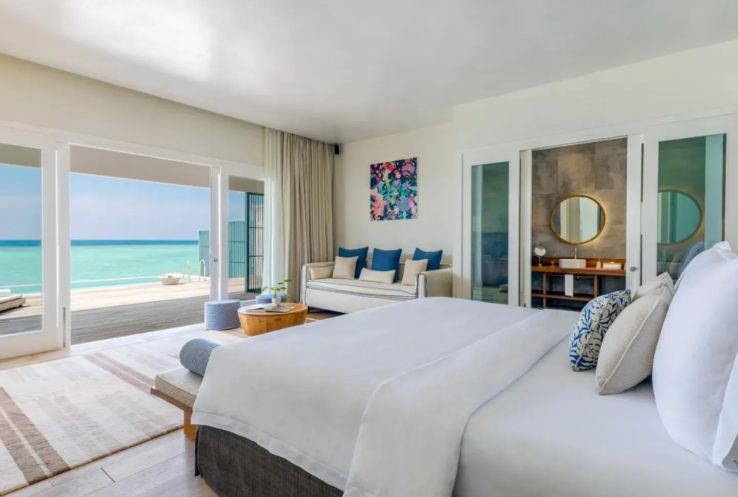 Bright and airy bedroom at Amilla Maldives, with ocean views in the Maldives.