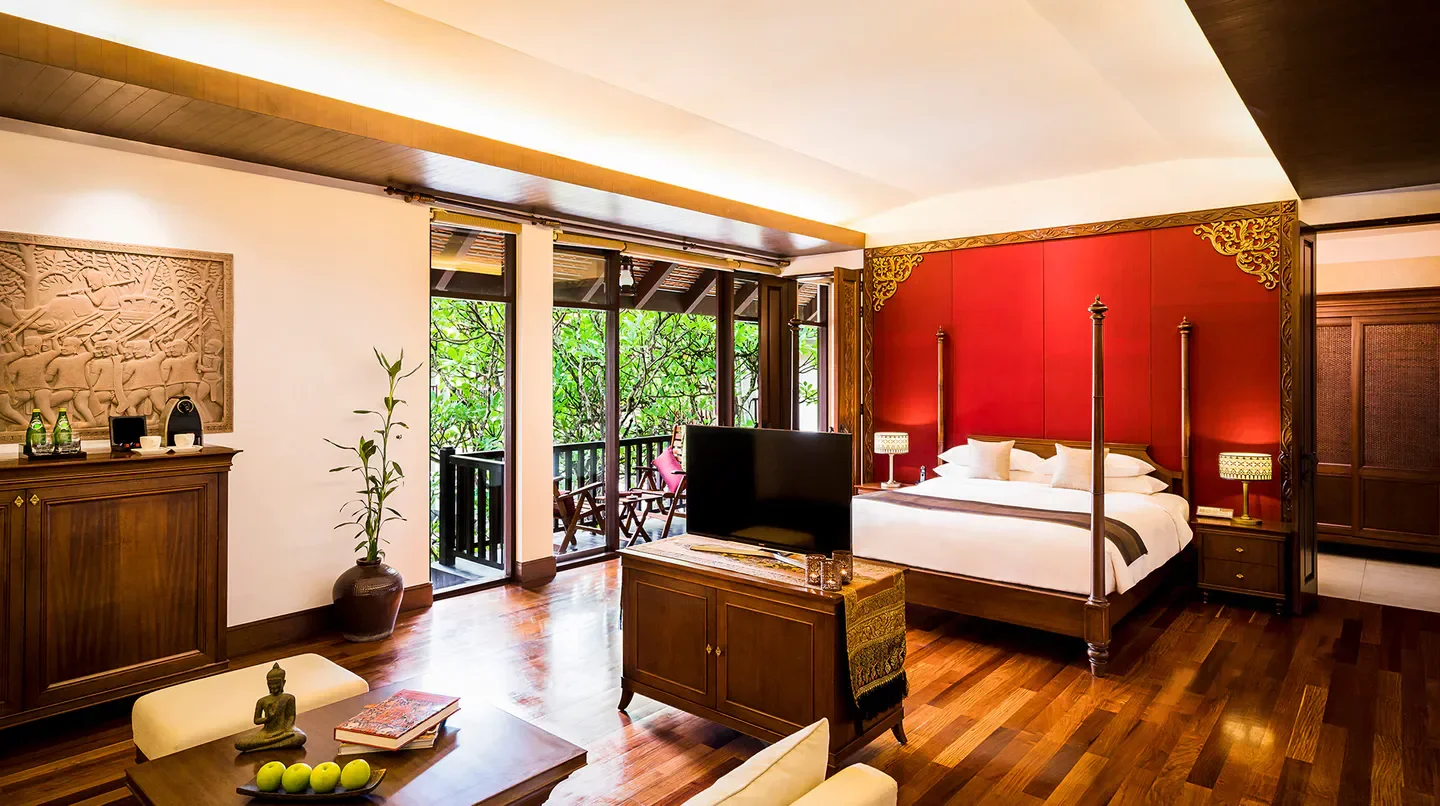 Luxurious suite at Anantara Angkor Resort in Siem Reap with balcony views.