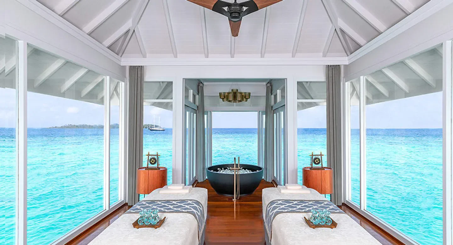 Spa treatment room at Anantara Kihavah Spa in the Maldives with ocean view.