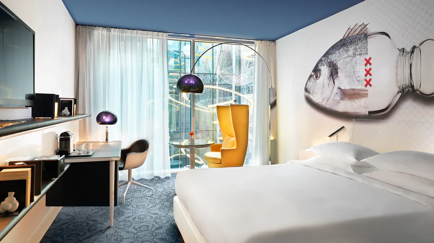 Stylish hotel room at Andaz Amsterdam Prinsengracht, featuring Amsterdam artwork and design.