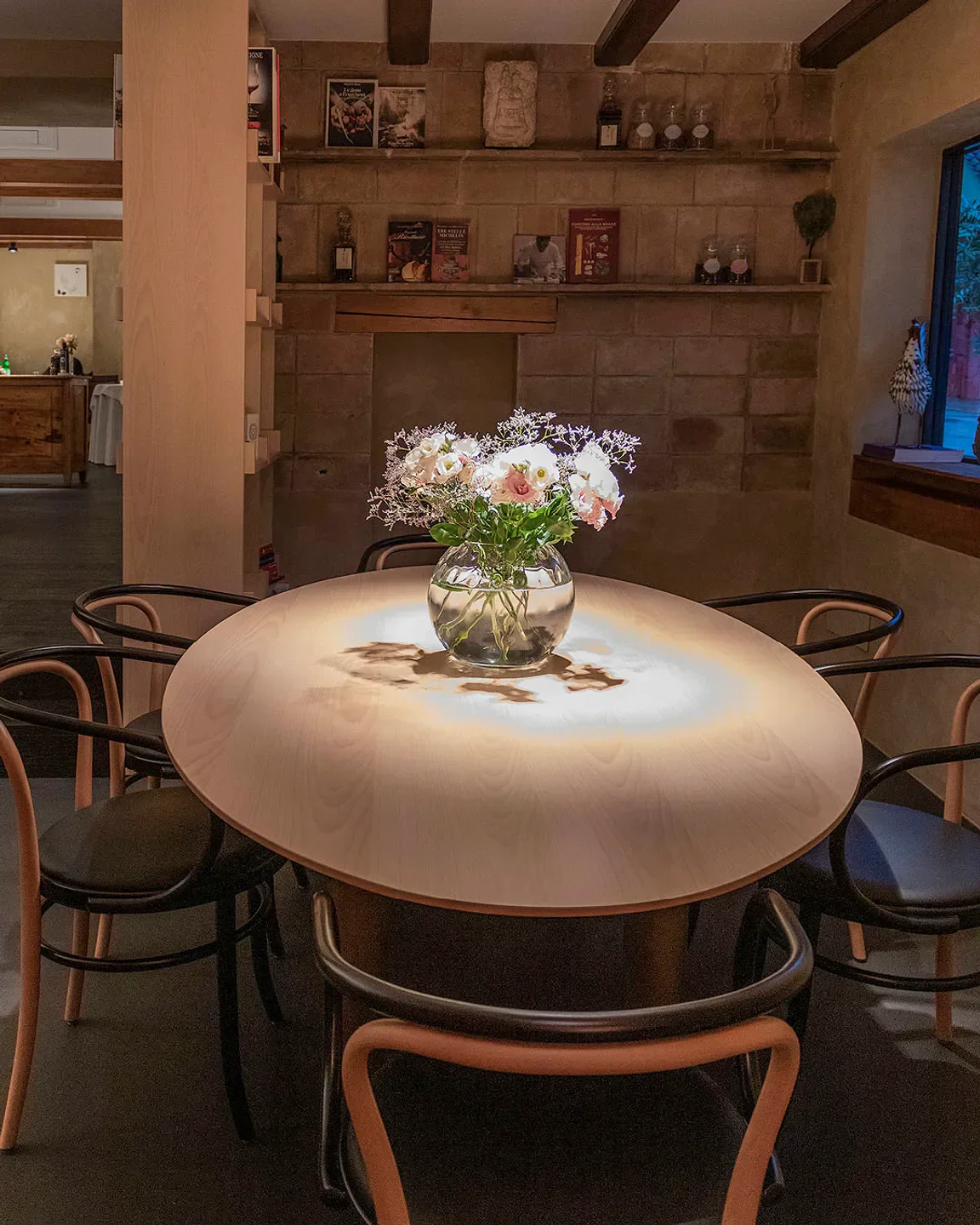 Cozy dining area at Andreina restaurant in Marche, featuring elegant table setting.