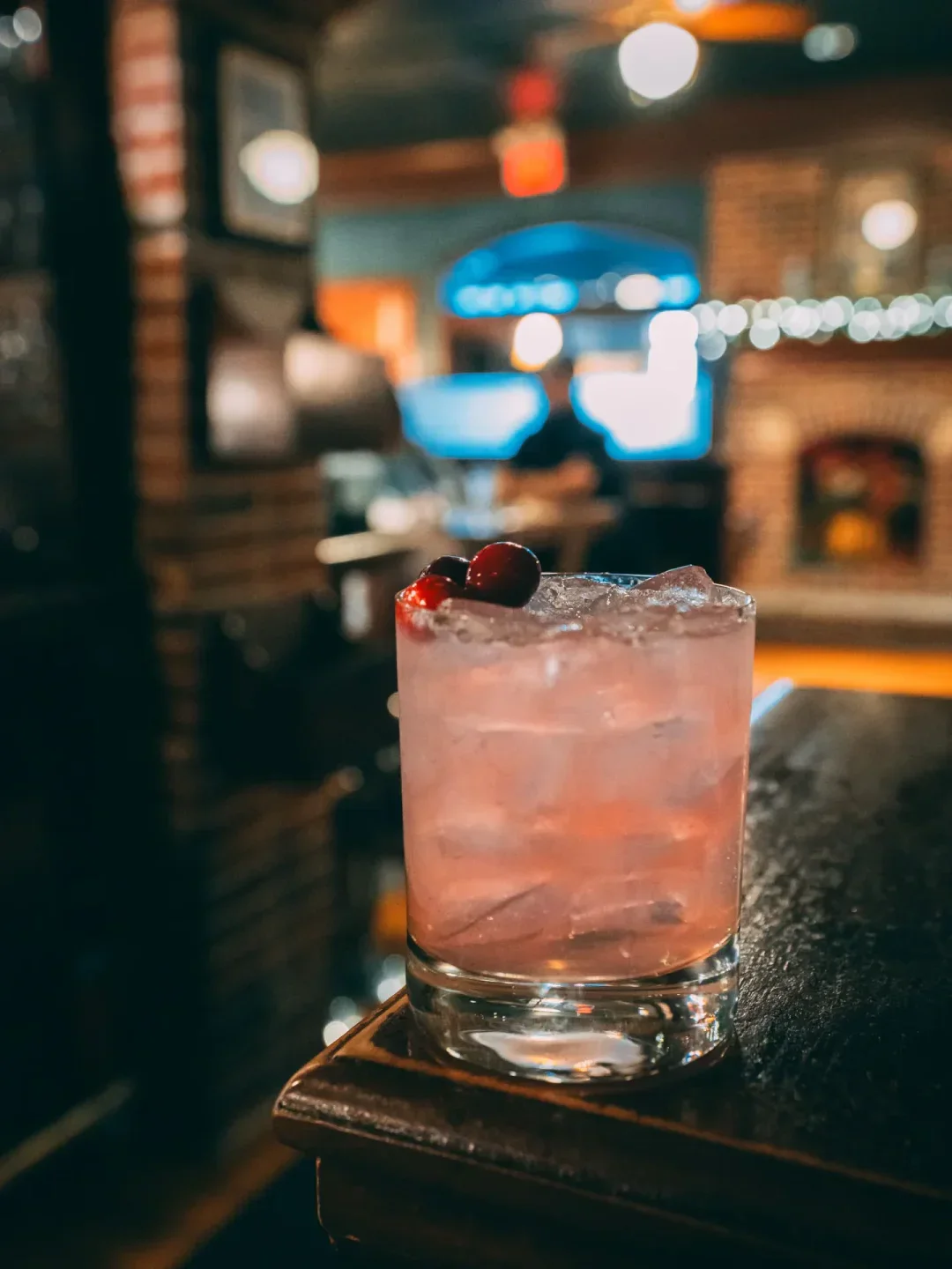 Refreshing cocktail at Annie Gunn's restaurant in St. Louis, with vibrant cranberry garnish