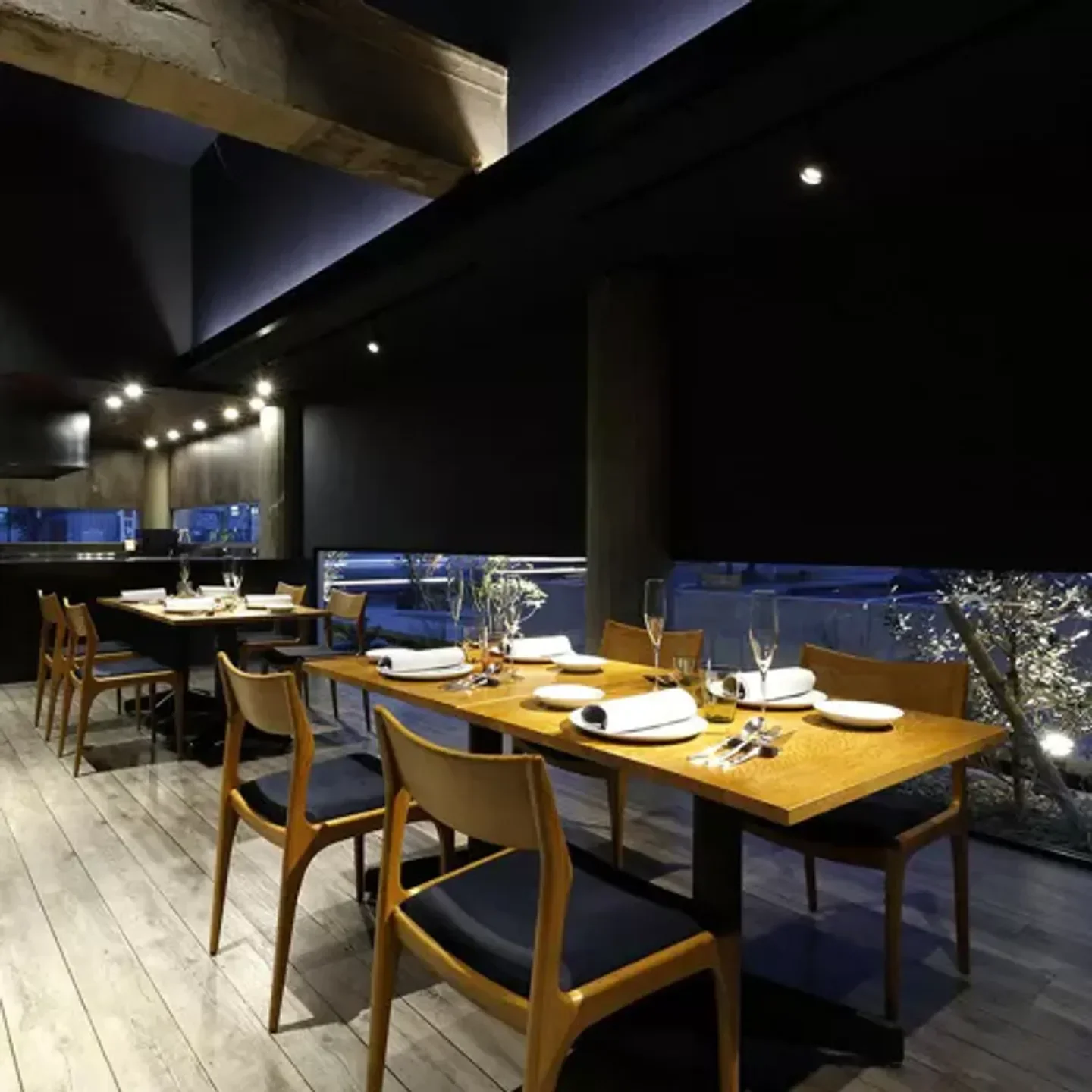 Elegant dining at anpeiji restaurant in Kyoto, featuring wooden tables and stylish chairs.