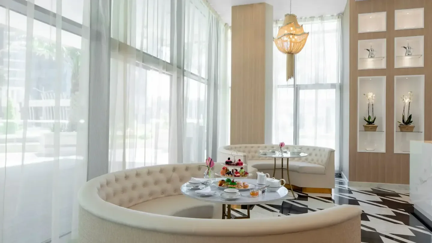 Elegant interior of Antoinette's restaurant in Doha, with a stylish afternoon tea setting.