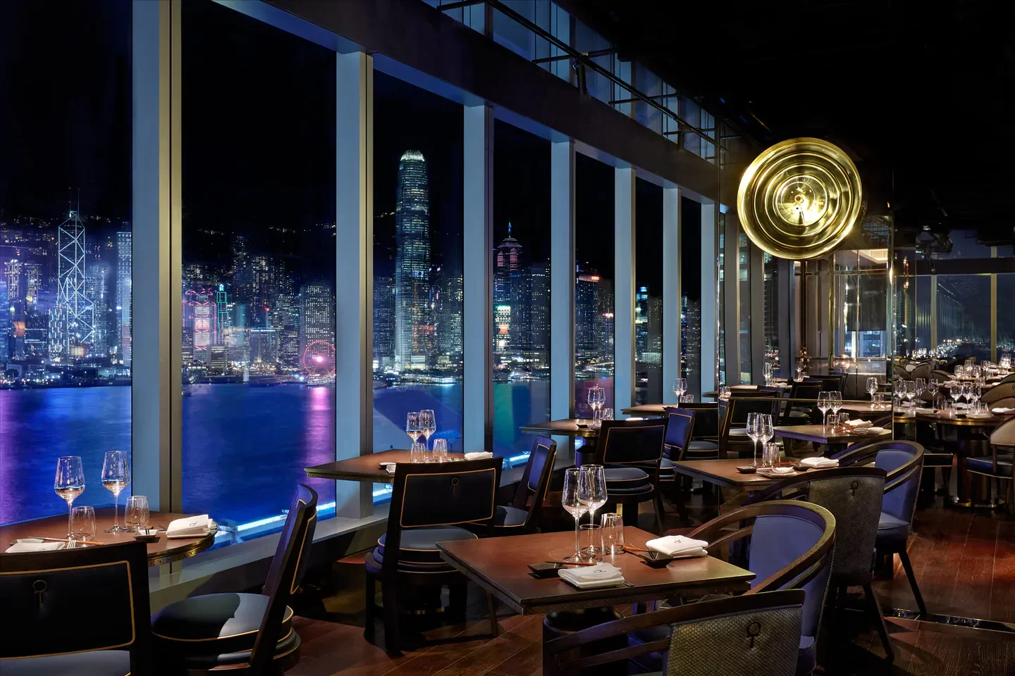 Aqua Hong Kong restaurant with stunning city views at night, overlooking the harbor.