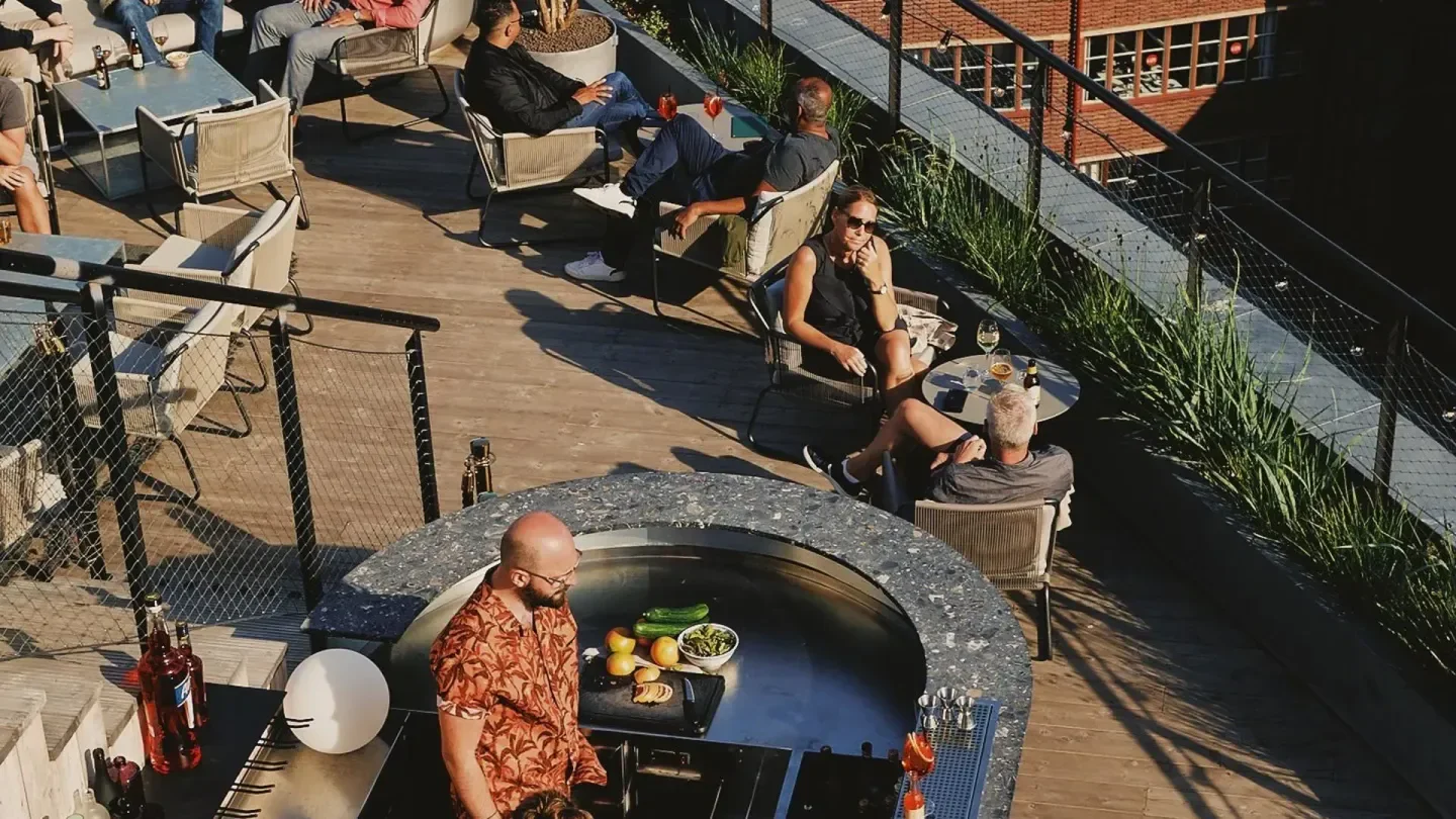 Rooftop dining experience at Arc in Stockholm with outdoor grill and city views