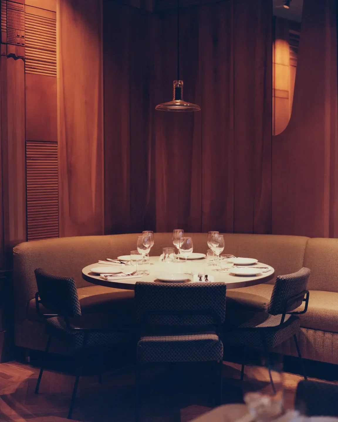 Cozy dining area at Arkestra restaurant in Istanbul, with a round table and elegant setting.