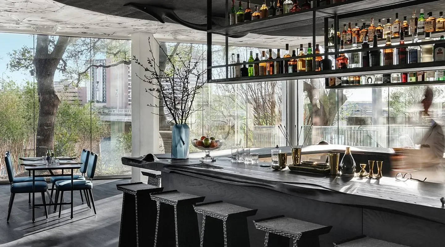 Interior bar at Arlo Grey by Kristen Kish, Austin, with a view of the city