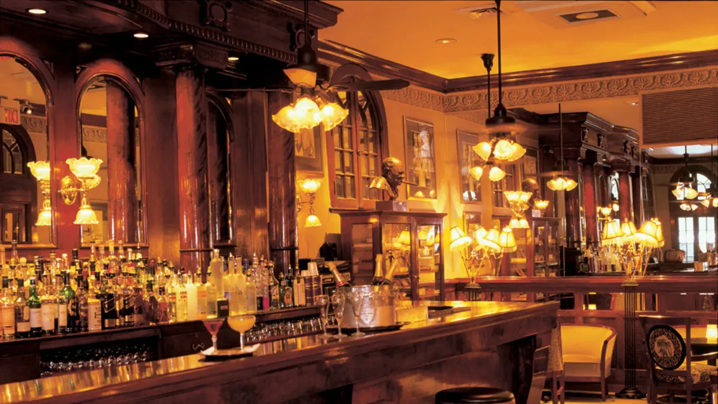 Interior of Arnaud's French 75 Bar in New Orleans, with its elegant lighting and decor