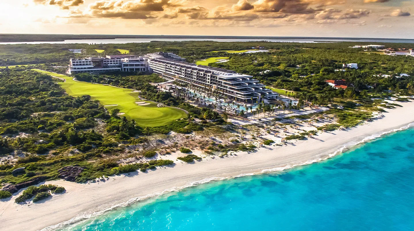 Aerial view of Atelier Playa Mujeres in Tulum, with stunning beachfront and golf course