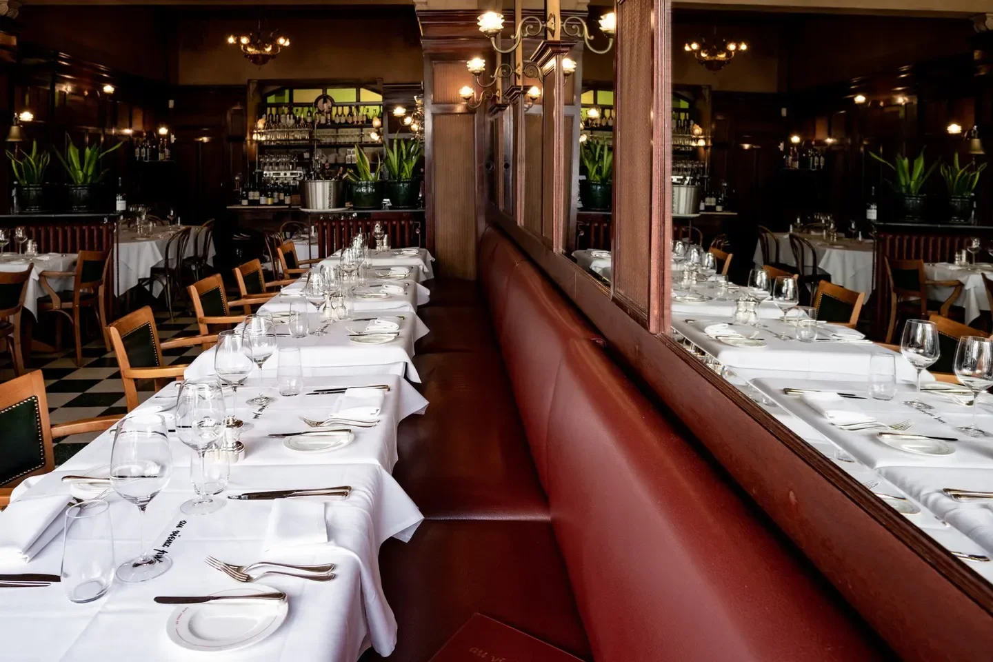 Elegant interior of Au Vieux Port in Antwerp, with tables set for dining