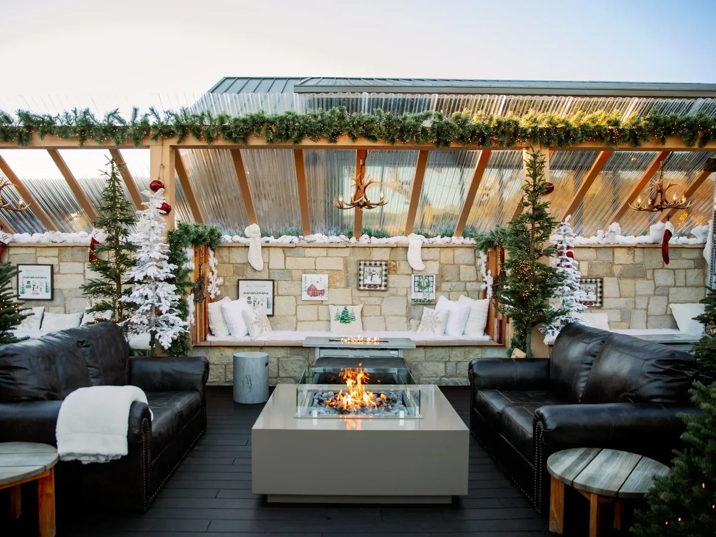 Cozy holiday seating area at AURO in Napa Valley, featuring a fireplace and festive decor.