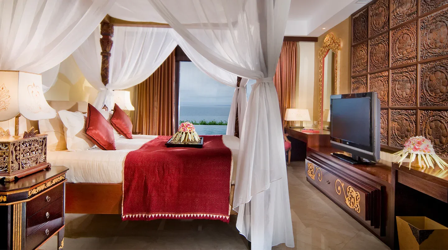 Luxury bedroom at AYANA Villas BALI with sea view, Bali, featuring a canopy bed.
