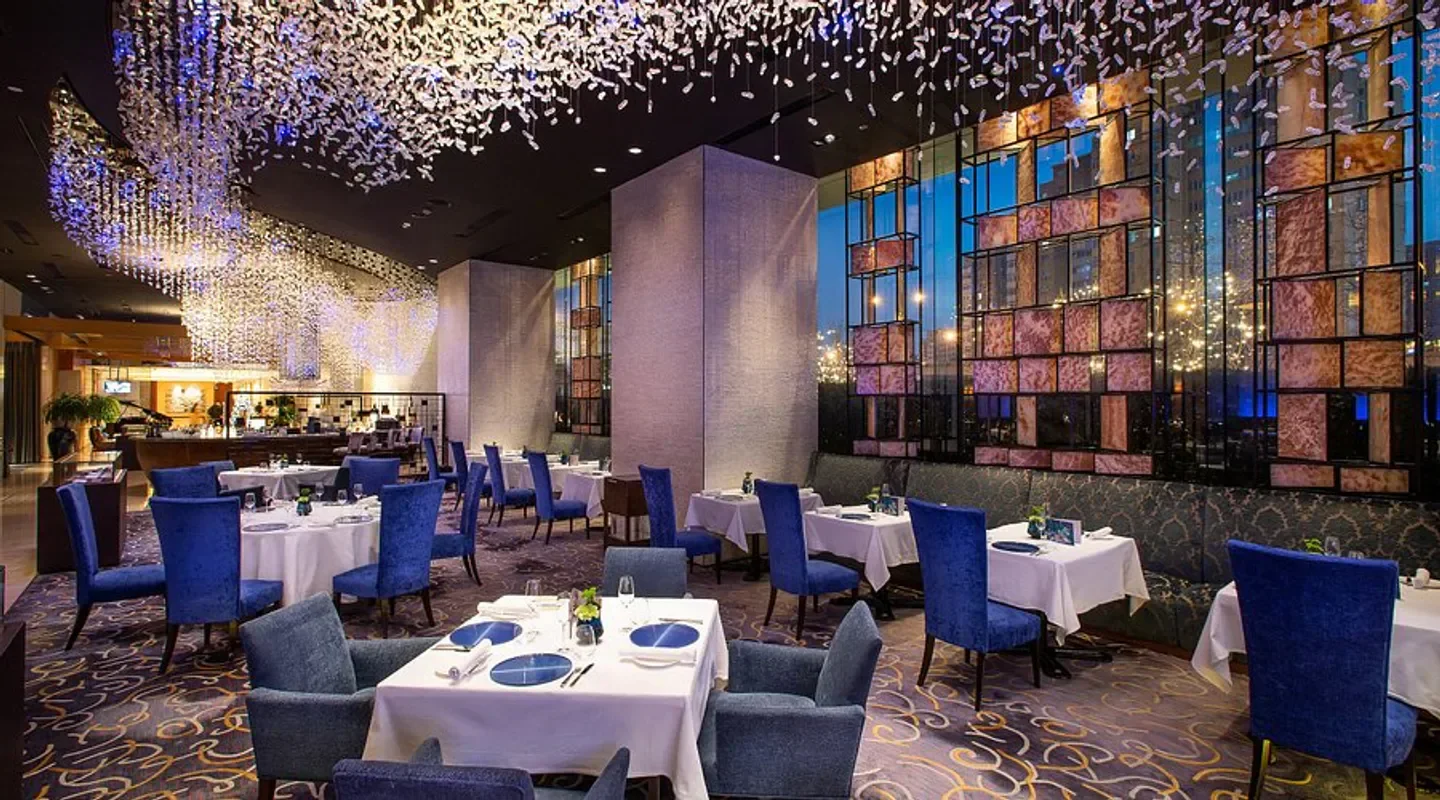 Elegant dining room at Azur by Mauro Colagreco in Beijing with a unique ceiling decor