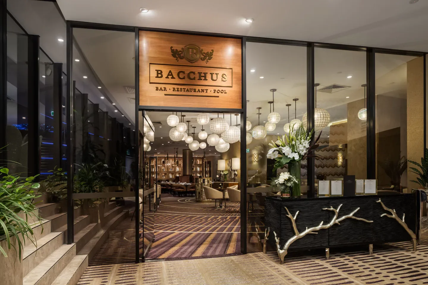 Entrance to Bacchus restaurant in Brisbane, featuring elegant decor and lighting.