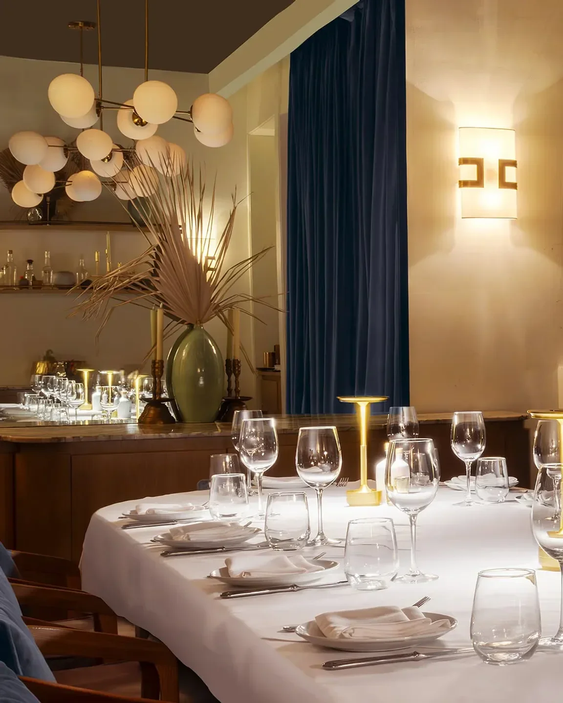 Elegant dining at Bagatelle Miami. A beautifully set table with wine glasses.